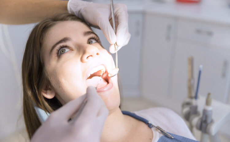 woman-having-teeth-examined-dentists